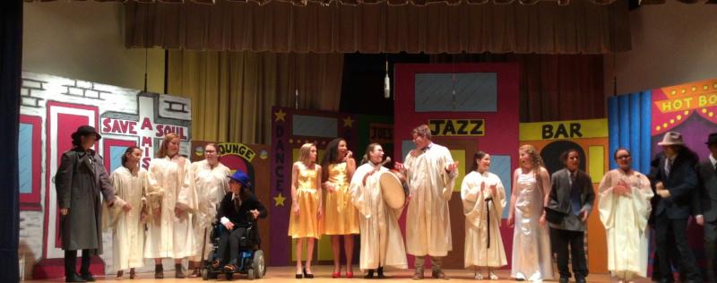 “Guys and Dolls Junior” cast members gathers for the ensemble song, “Happy Ending.” Shown are (l-r) Allison Mack, Sara Perrotta, Emily Uffelman, Ruby Lundeen, Annmarie Perrotta, Josephine Ingerski, KyZei Vester, May Dillard, Thomas Weeks, Bella Myers, Amanda Holtgrewe, ZyKai Vester, Amala West, Alexis Barker and Andrew Garcia (partially hidden). SUBMITTED PHOTO
